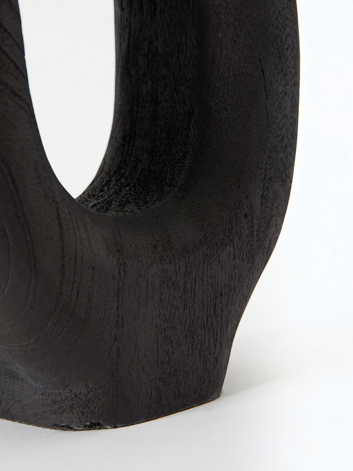 Lyckåsen Qvist 408 table lamp in black sandblasted wood with a smooth, sculptural curved design.