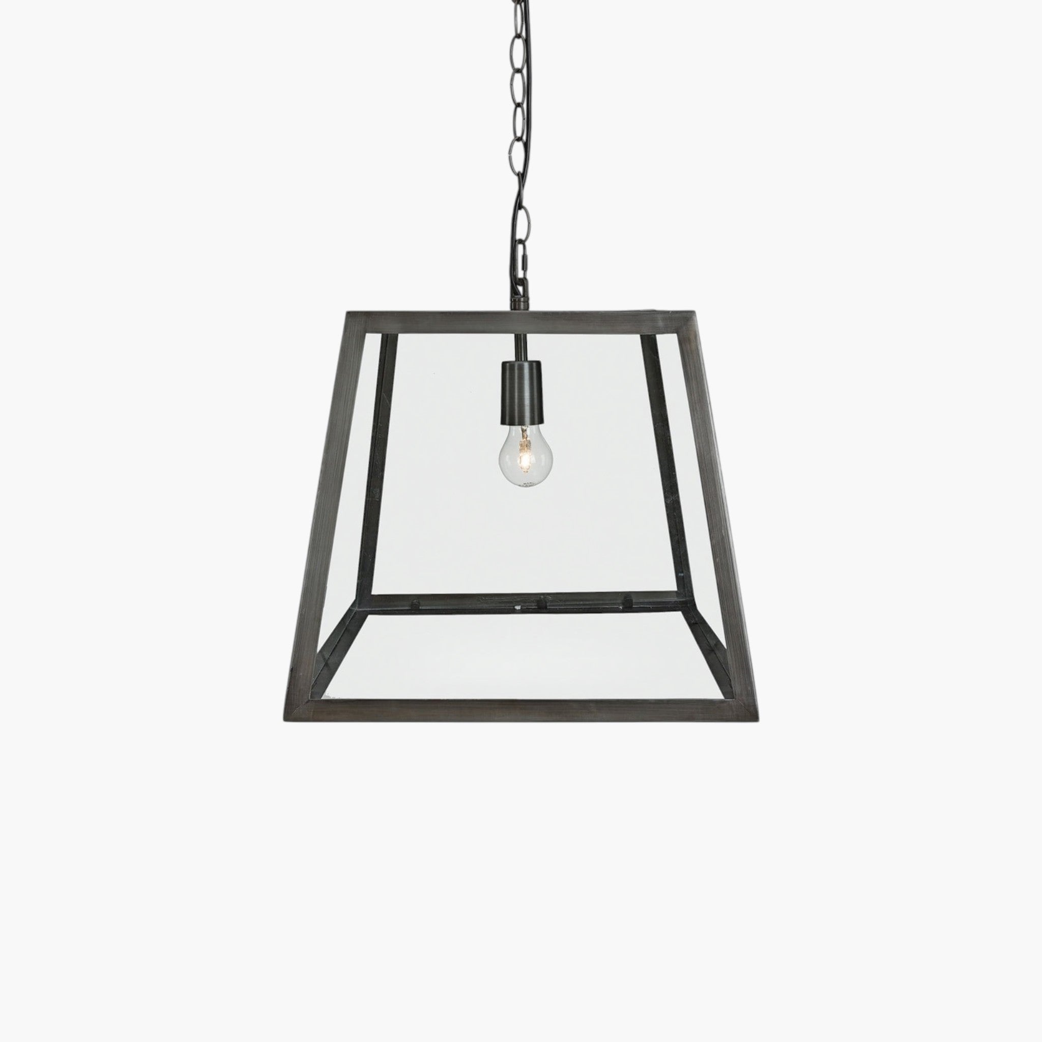 Lyckåsen Big City pendant lamp with a black iron frame and clear tempered glass panels on a hanging chain.