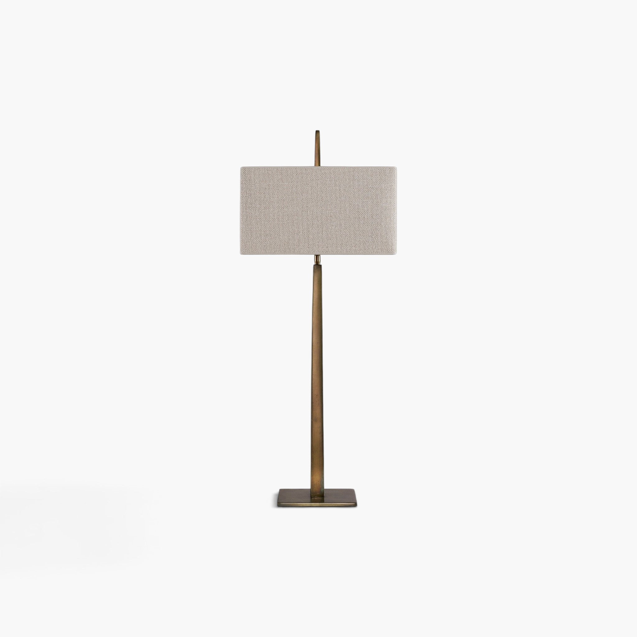 Lyckåsen Caligo table lamp in antique brass with a rectangular beige fabric shade and a sleek metal base.
