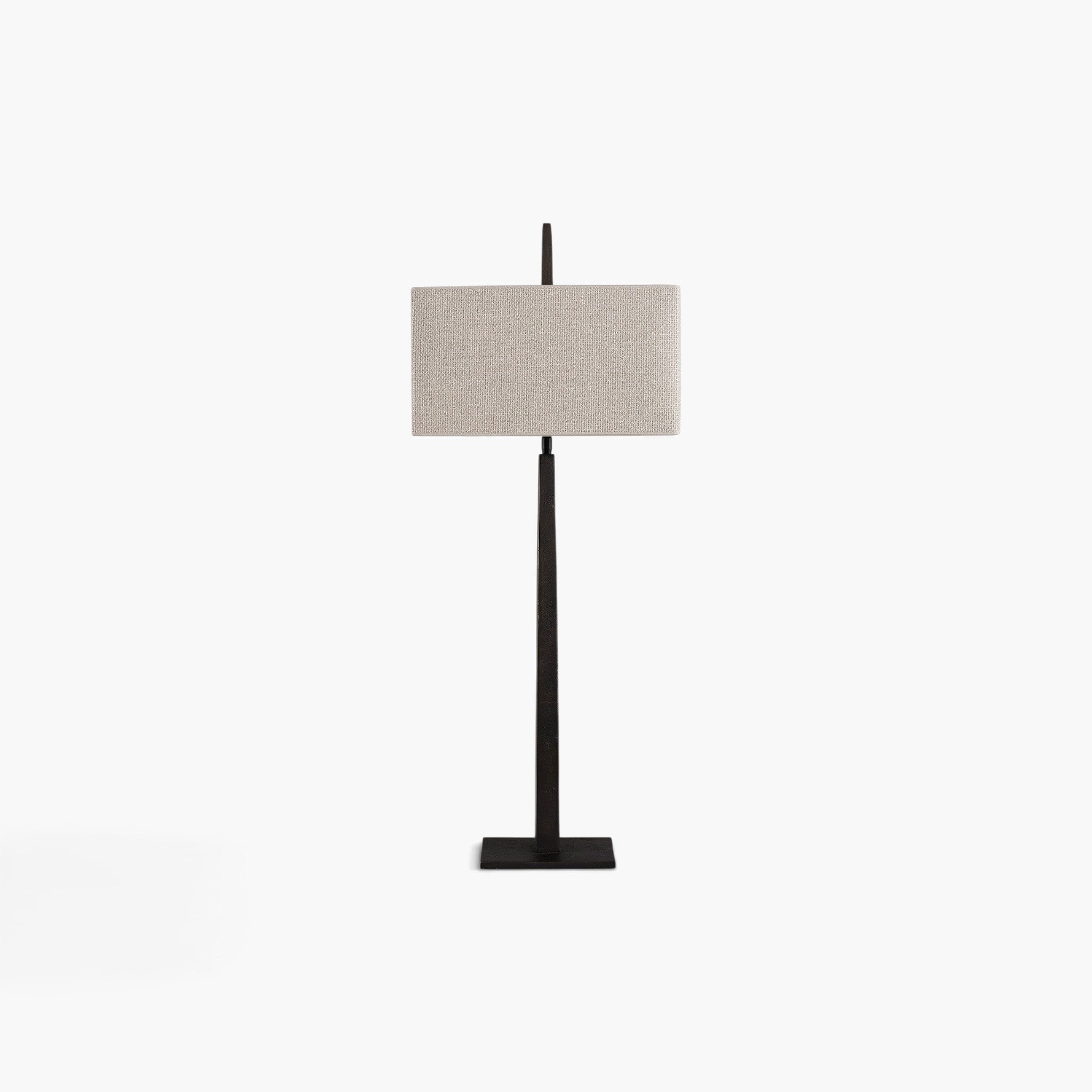 Lyckåsen Caligo table lamp in antique bronze metal with a rectangular beige fabric shade on a white background
