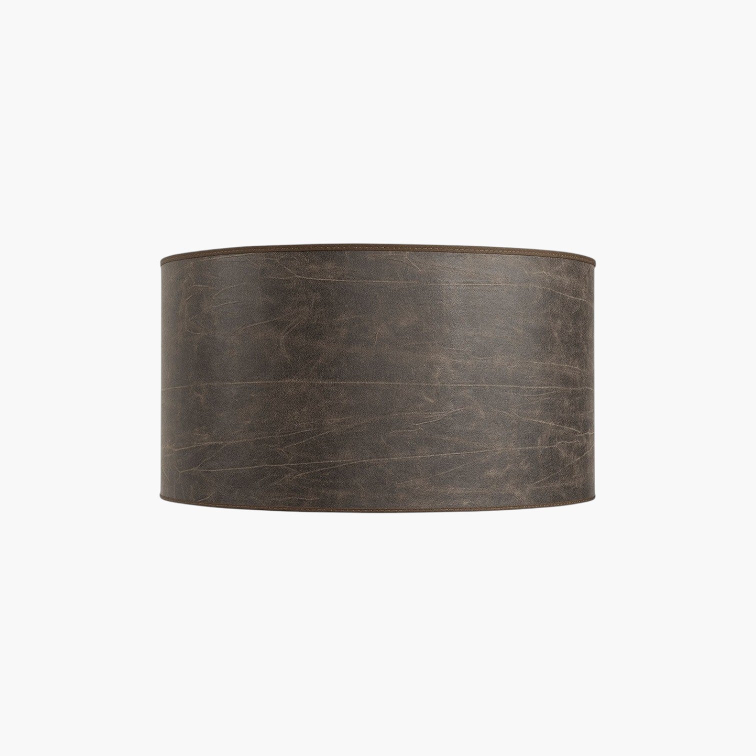 Lyckåsen Shade Cylinder lampshade in a pale brown leather finish with a textured, minimalist design.