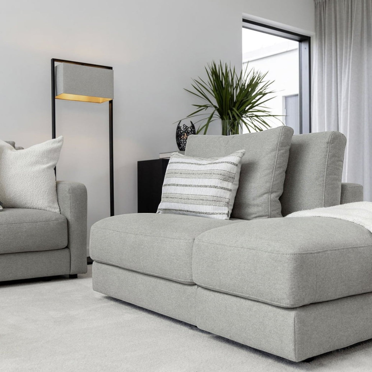 Lyckåsen Shade Donati rectangular floor lamp with a natural fabric shade and black frame in a modern living room.