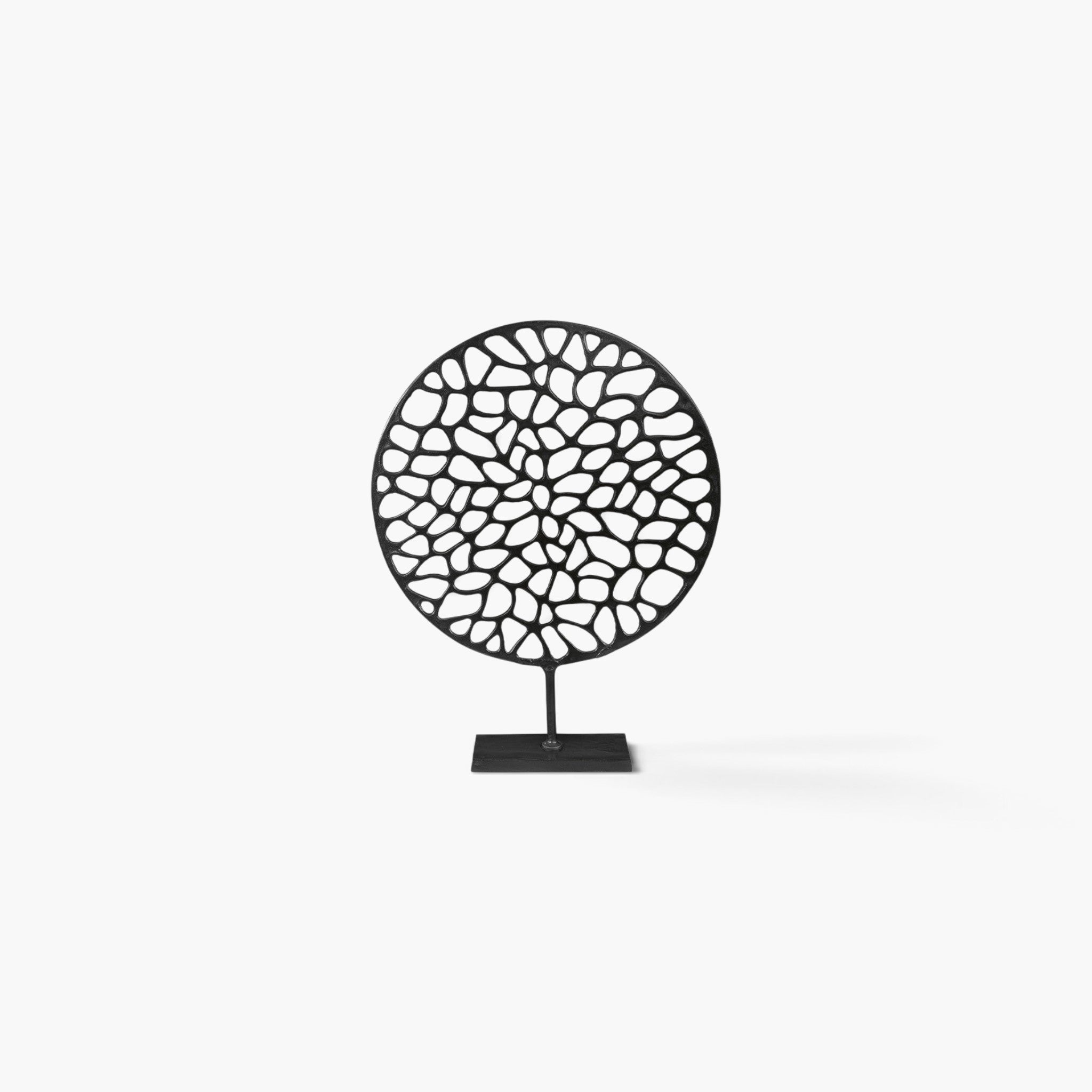 Lyckåsen Flavio round black metal decorative sculpture with an intricate organic cutout pattern on a square base.