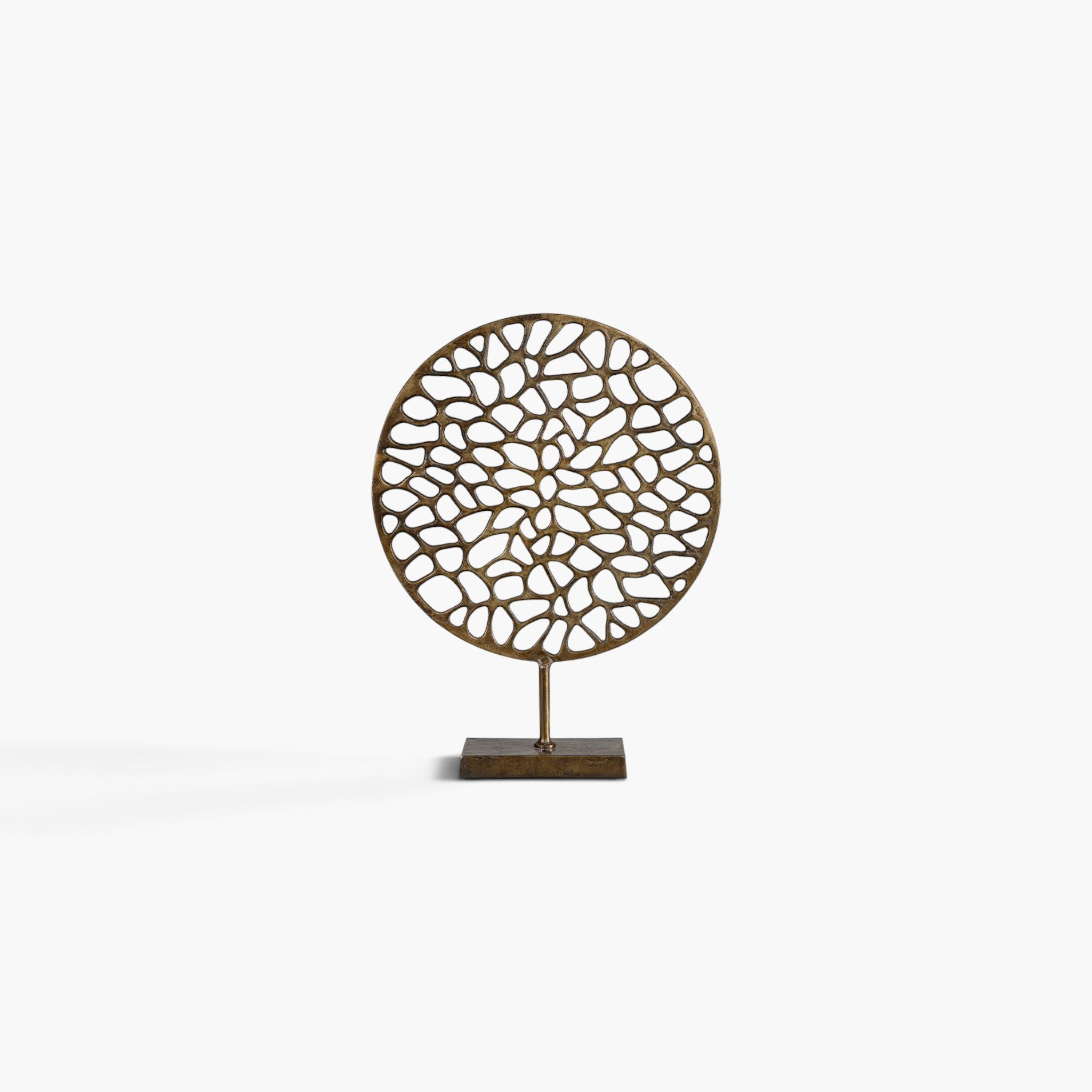 Lyckåsen Flavio round vintage brass decorative sculpture with an intricate organic cutout pattern on a square base.