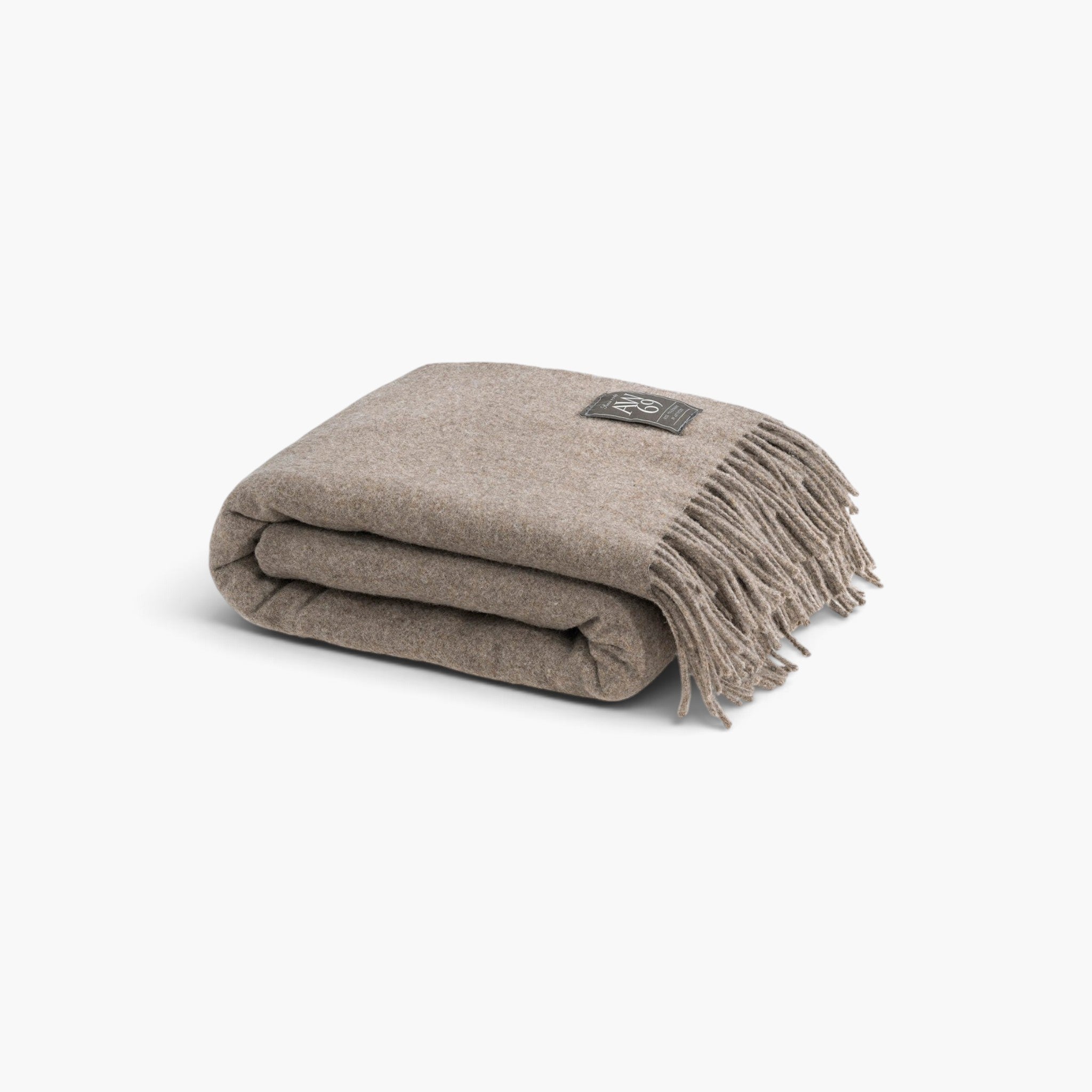 Lyckåsen Livigno taupe wool and cashmere throw blanket with decorative fringe and branded logo patch.
