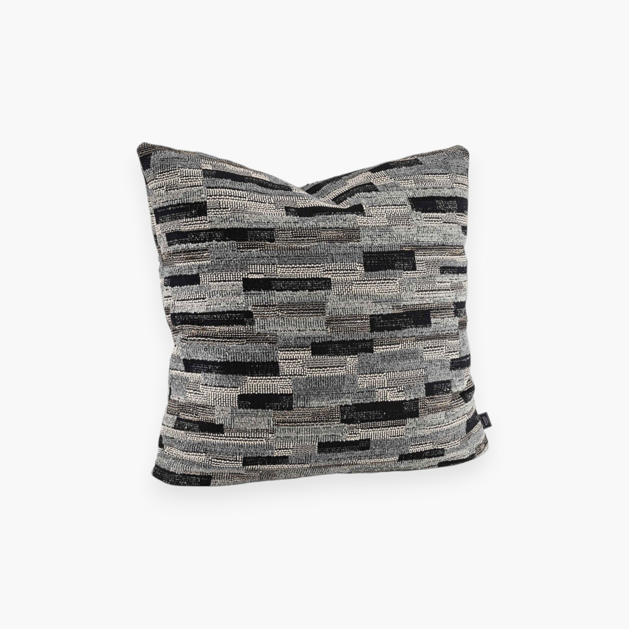 Lyckåsen Pallice cushion cover with a modern grey and black geometric woven pattern and textured fabric surface.