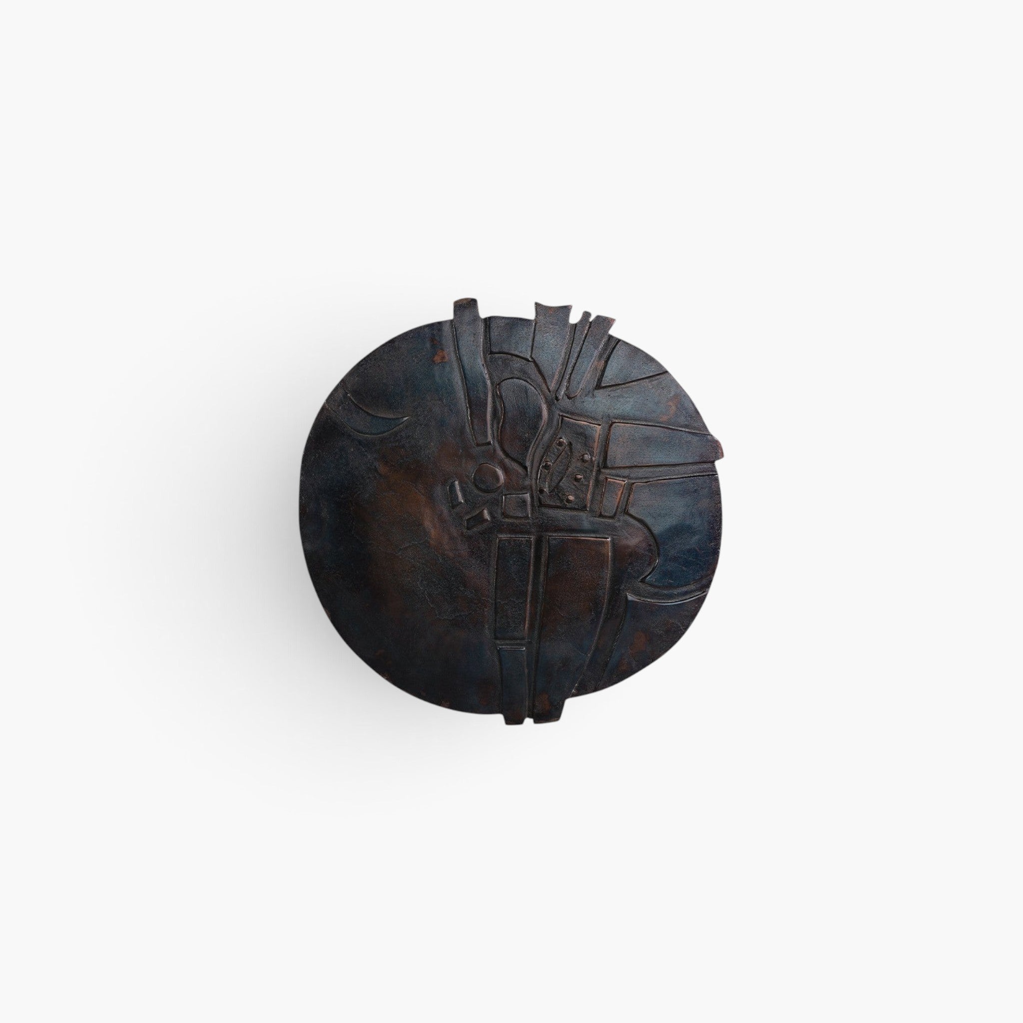 Lyckåsen round dark blue bronze metal wall art with abstract geometric relief texture for modern home decor.