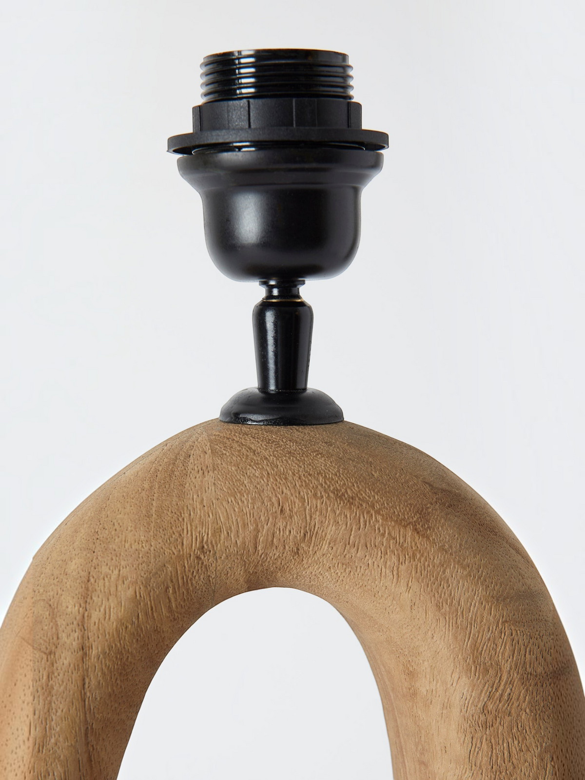 Lyckåsen Qvist 408 table lamp in light brown sandblasted natural wood with an organic shape and black metal socket.