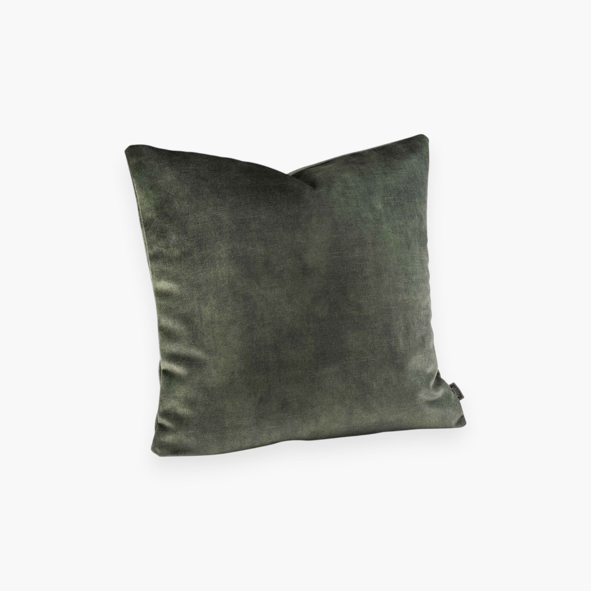 Lyckåsen Avanna hunter green velvet cushion cover with a soft, shimmering texture and hidden zipper closure.