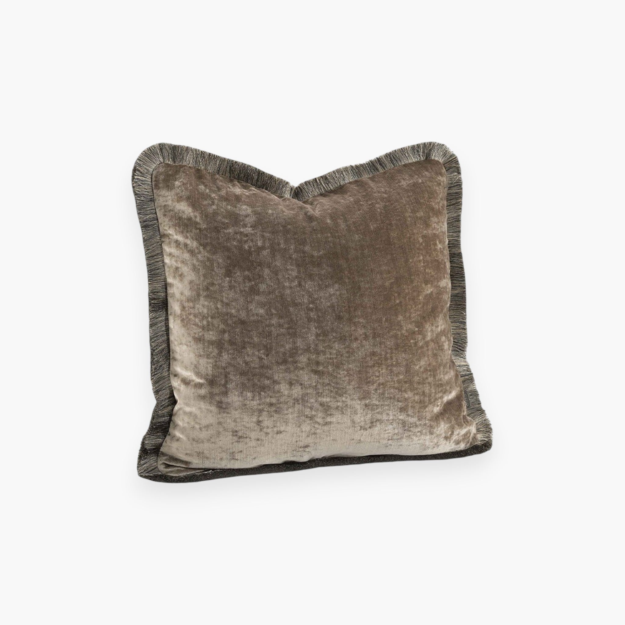 Lyckåsen beige velvet cushion cover with decorative fringe trim and a soft, shimmering texture.