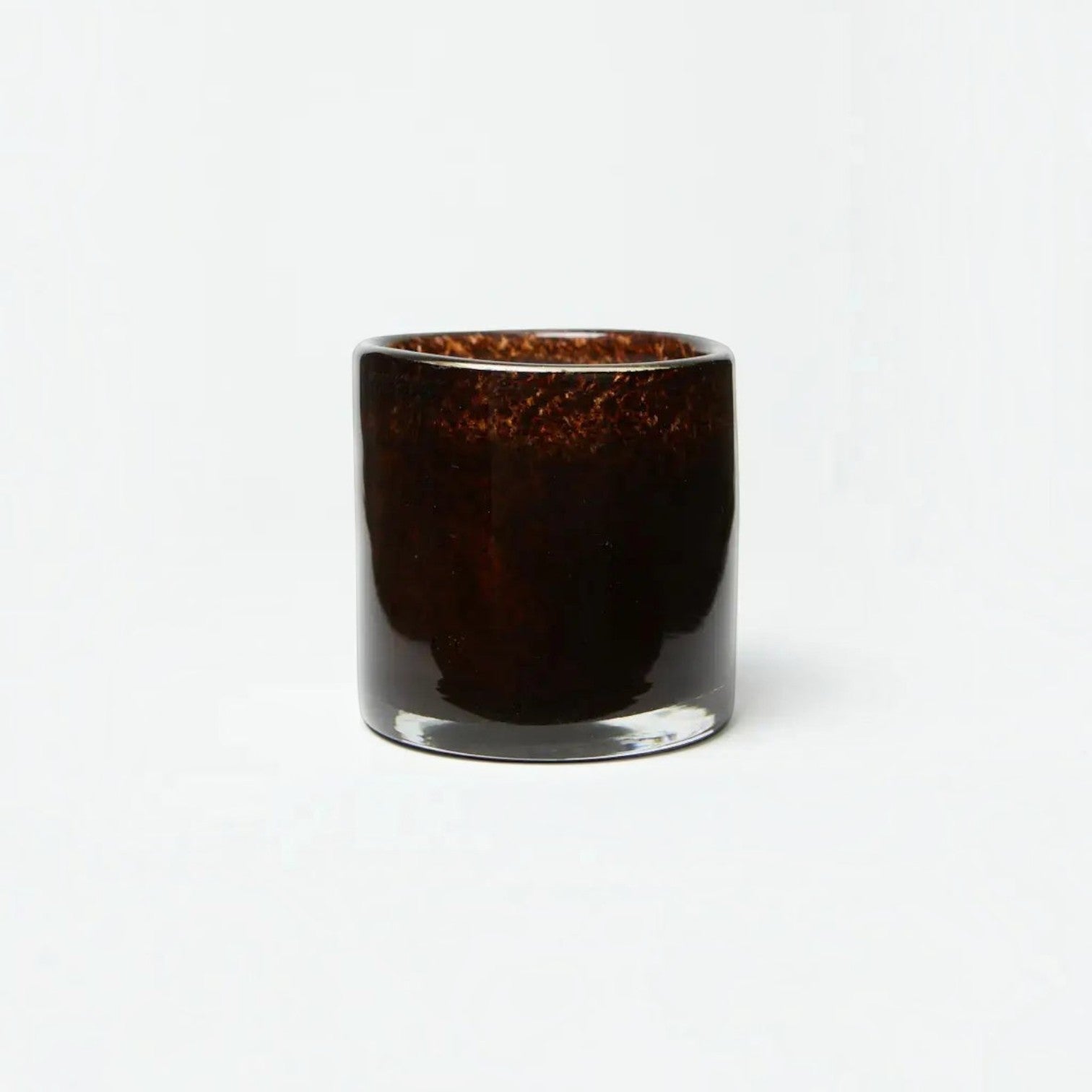 Lyckåsen Berlin Flamenco scented candle in a dark brown, hand-blown glass vessel with a 50-hour burn time.