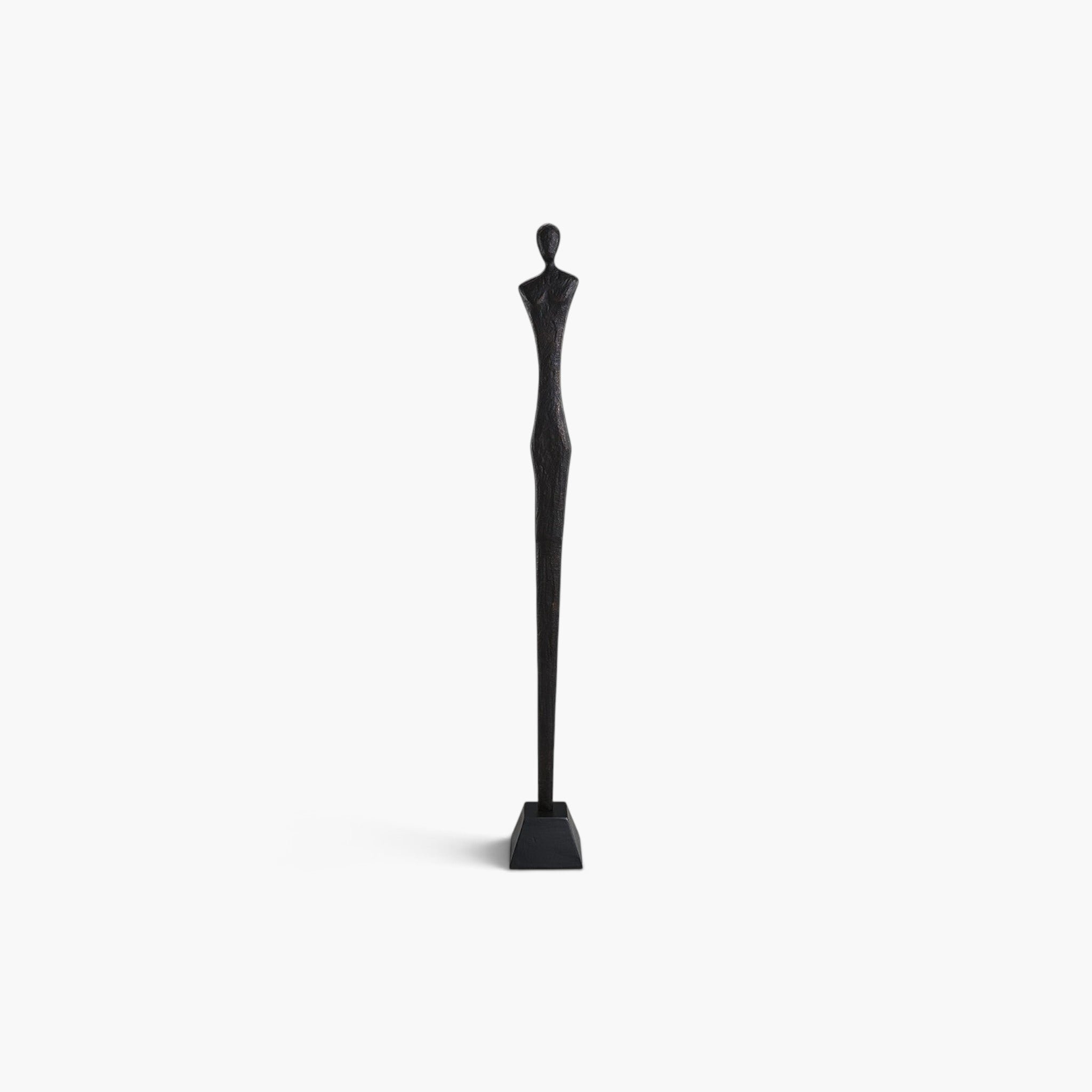 Lyckåsen Donna minimalist floor statue in antique black bronze metal with a textured finish and slender silhouette.