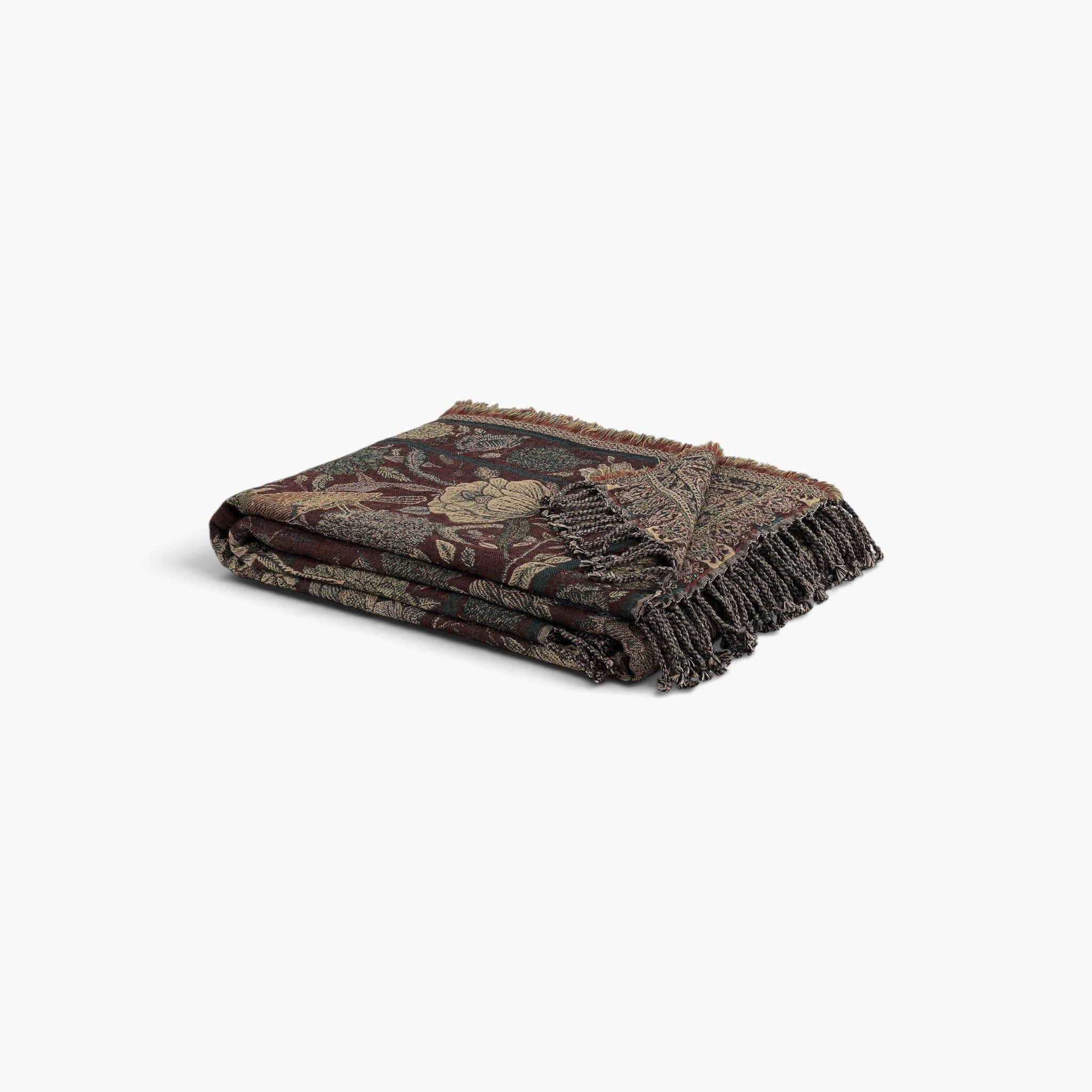 Lyckåsen Erosa reversible burgundy throw blanket in merino wool and cotton blend with decorative floral pattern