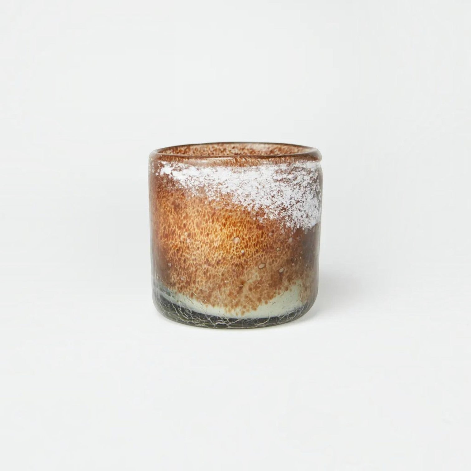 Lyckåsen Paris scented candle in a unique, hand-blown brown and white speckled glass vessel.
