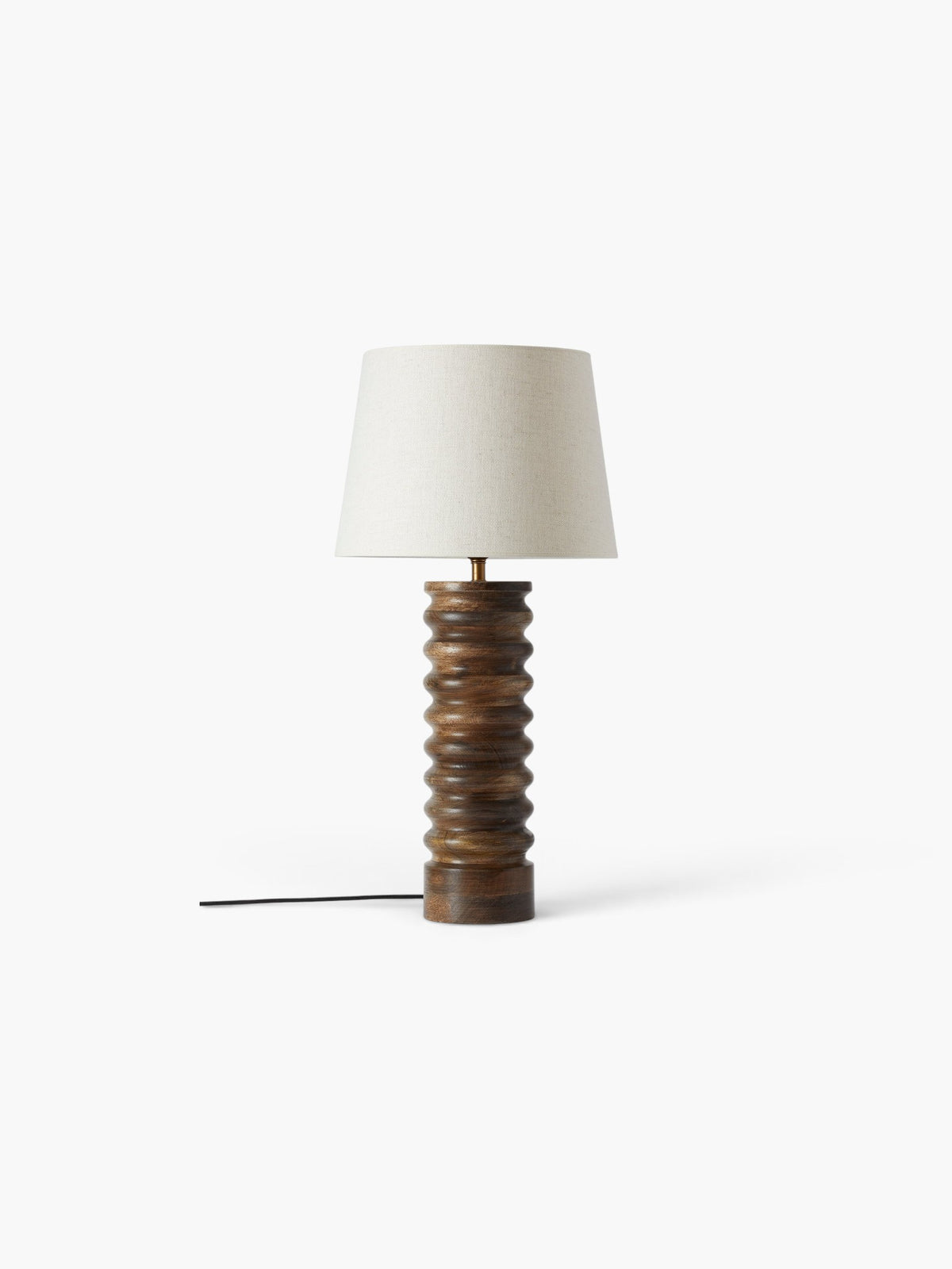 Lyckåsen Qvist 412 table lamp with a ribbed walnut wood base and a neutral fabric shade on a white background