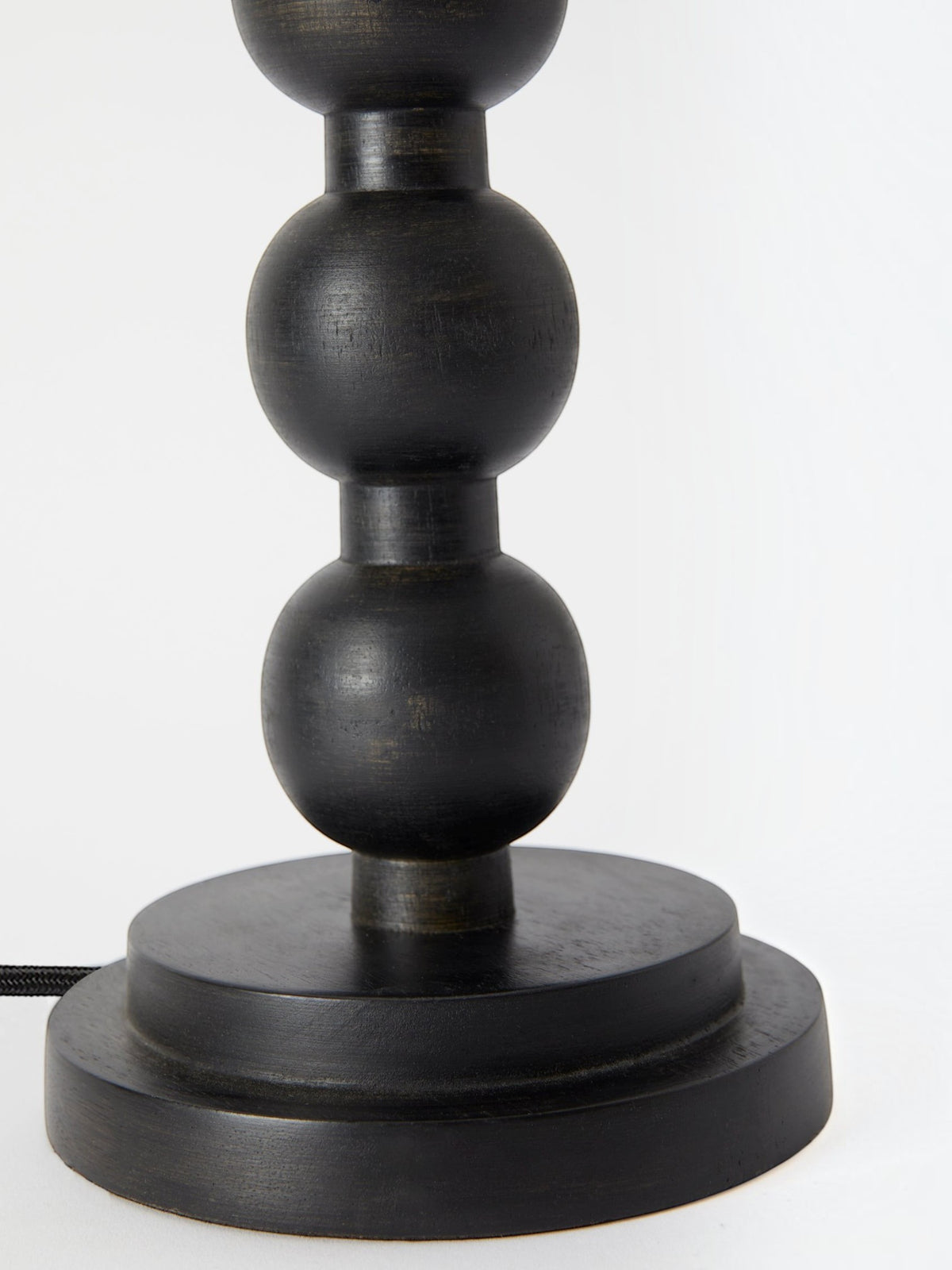 Lyckåsen Qvist 413 black wooden table lamp base with a modern turned sphere design and fabric cord