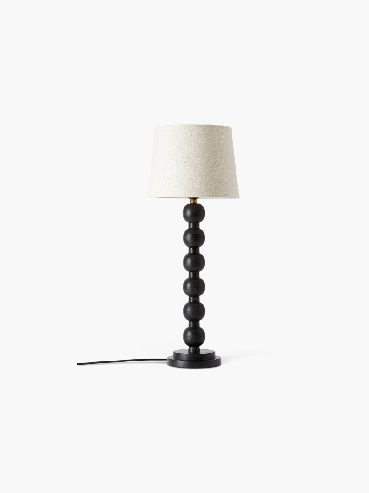 Lyckåsen Qvist 413 black wooden table lamp with a stacked sphere base and a neutral fabric lampshade.