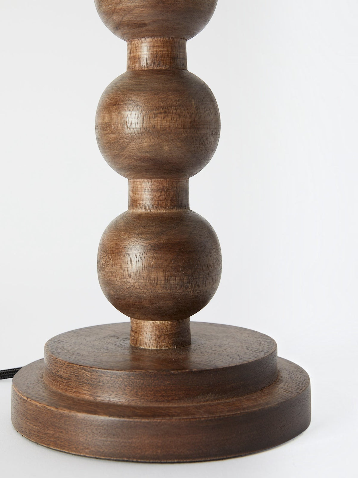Lyckåsen Qvist 413 table lamp base in brown walnut wood with a decorative stacked sphere design and fabric cord.