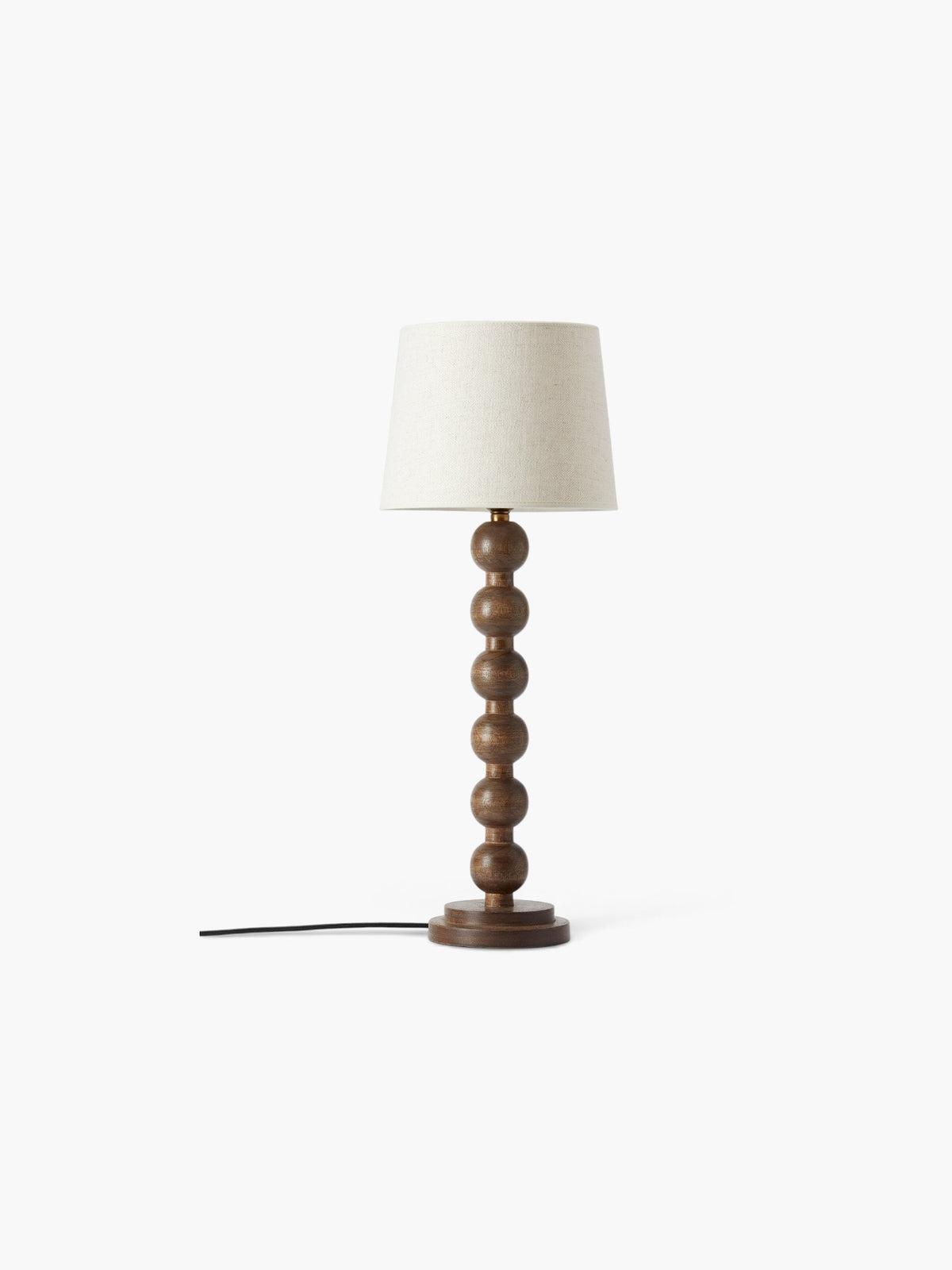 Lyckåsen Qvist 413 table lamp with a stacked wooden ball base in walnut finish and a beige fabric shade.