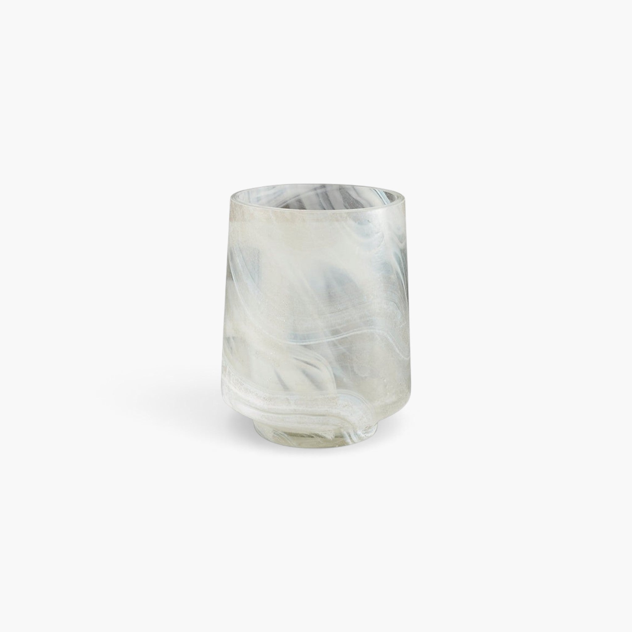 Lyckåsen Reef hand-blown glass candle holder in pale sand with a unique marbled pattern.