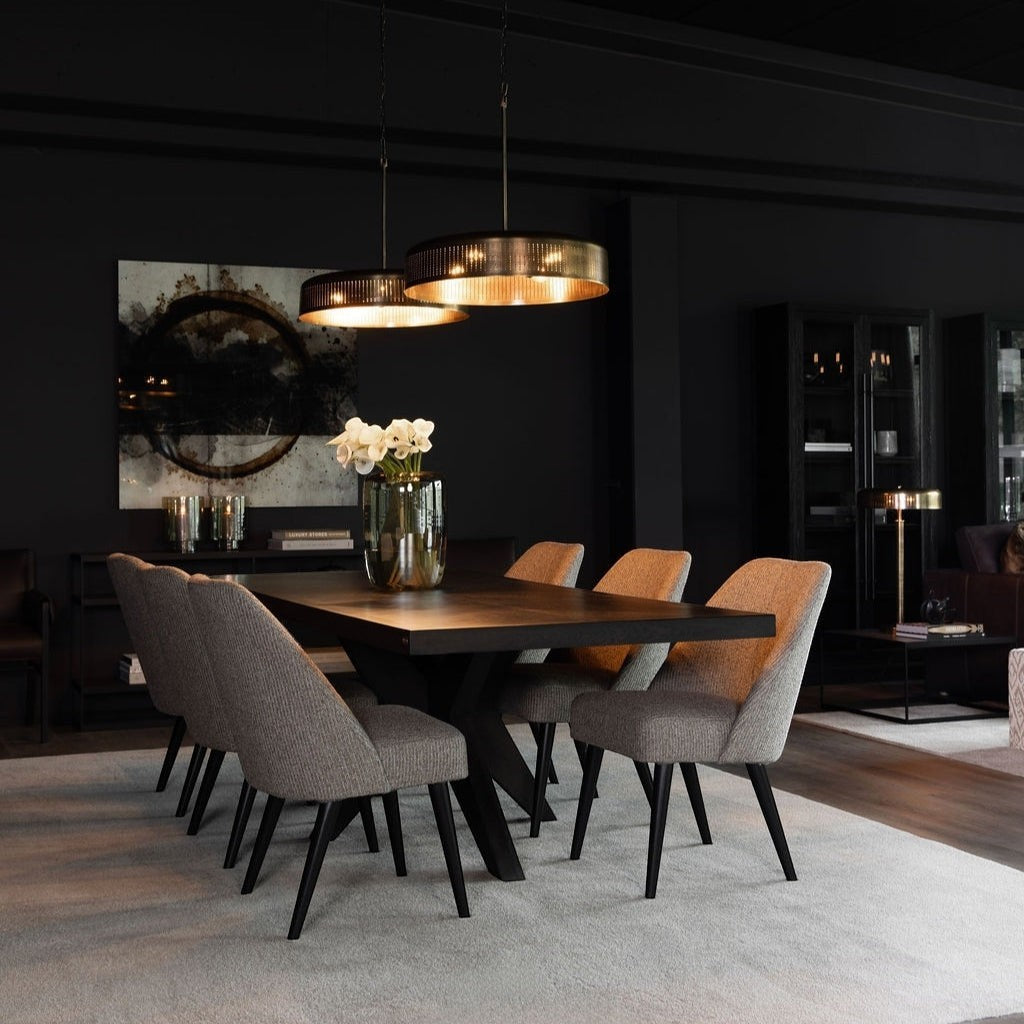 Lyckåsen Reef hand-blown glass vase in smoke brown on a dark wooden dining table in a modern interior