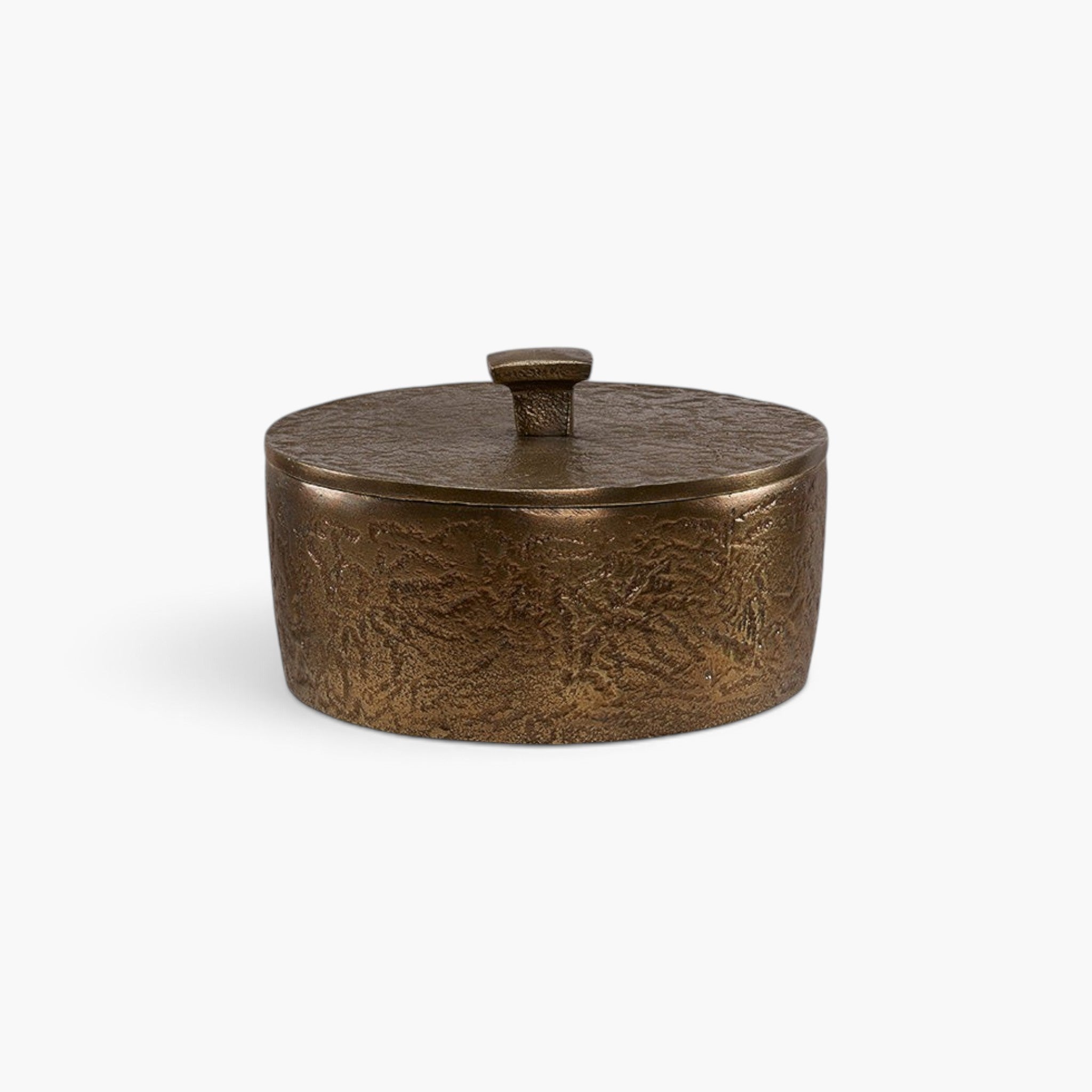 Lyckåsen Renzo decorative round metal box in antique brass with a rustic textured finish and a small lid handle.
