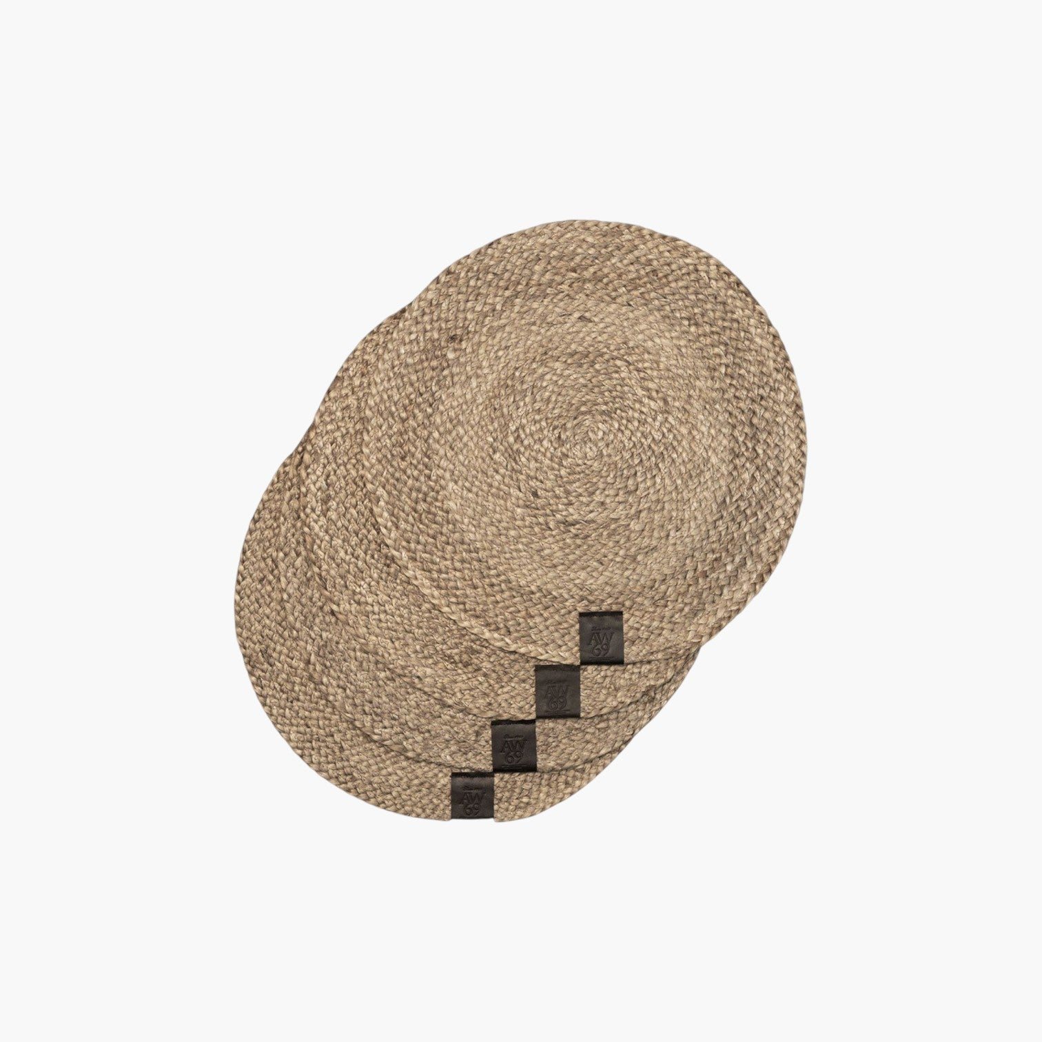 Lyckåsen set of four round braided jute placemats in natural beige with small leather brand tags