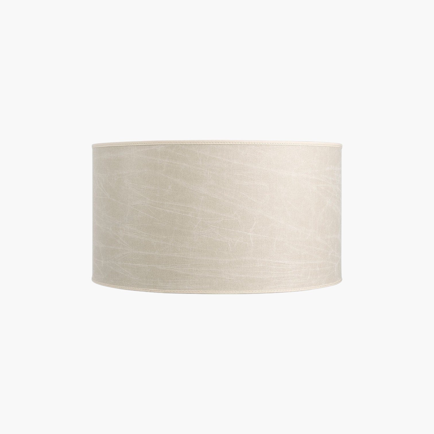 Lyckåsen Shade Cylinder lampshade in leather cream fabric with a textured finish for a soft, warm light diffusion.