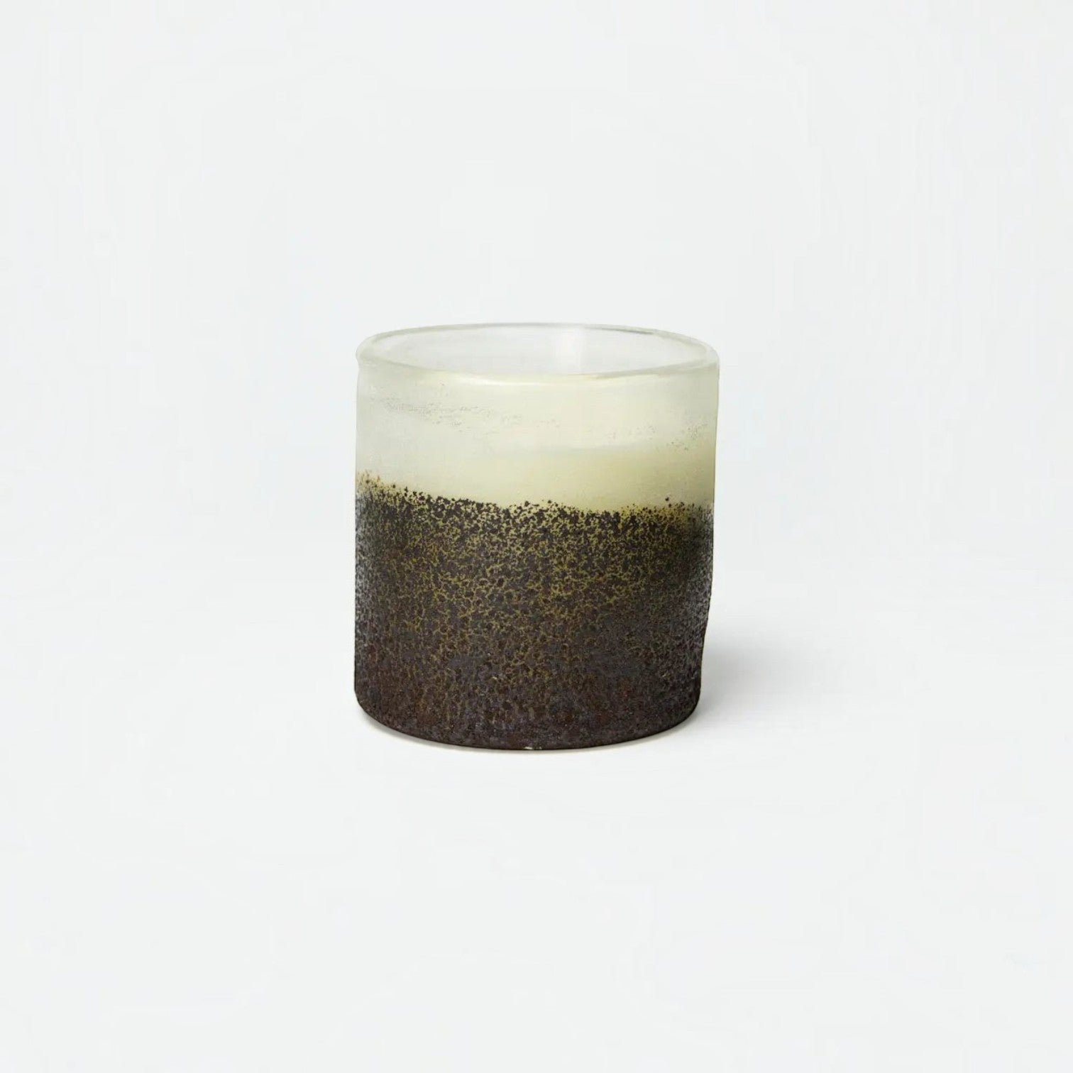 Lyckåsen Stockholm pear and fig scented candle in a textured, hand-crafted two-tone glass container.