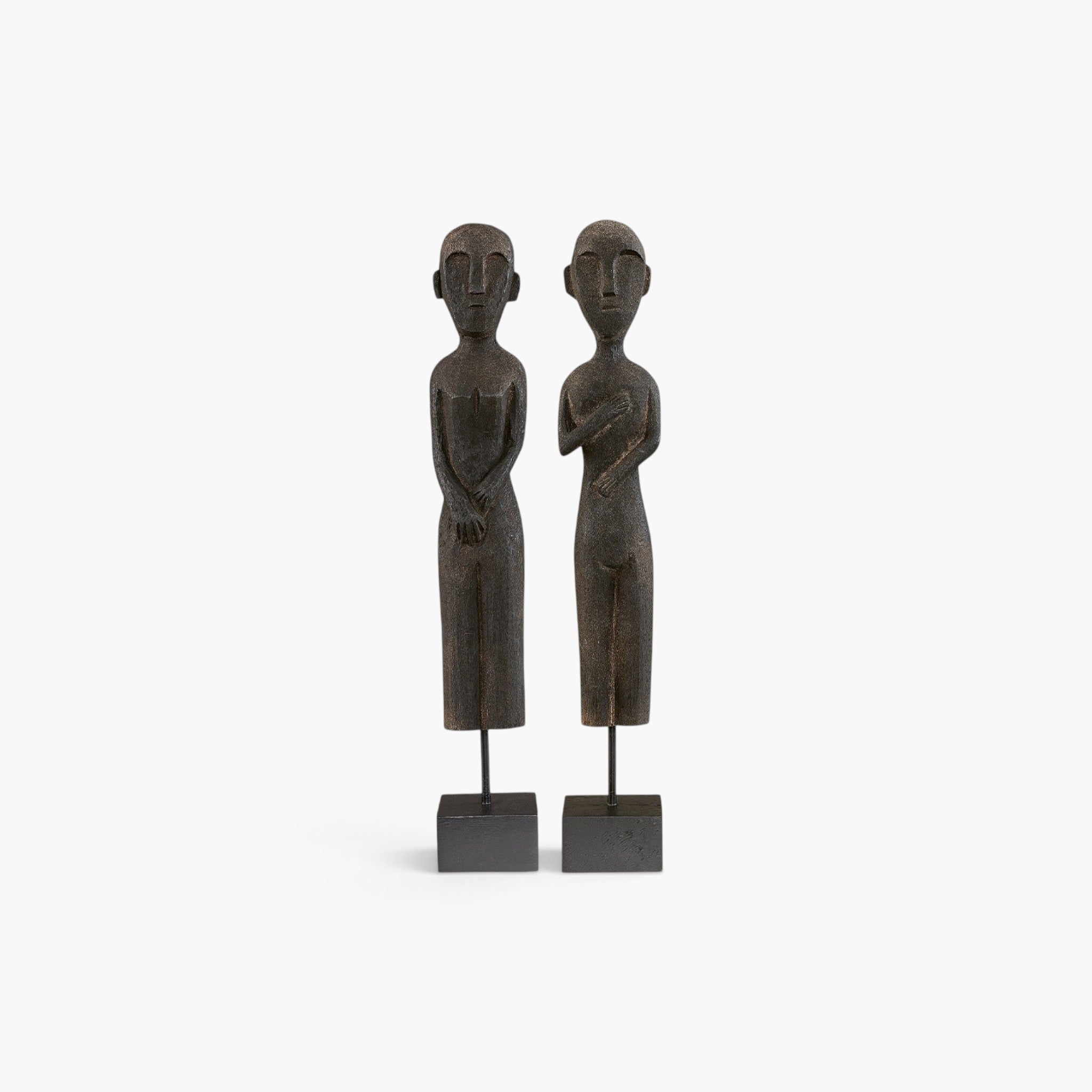 Lyckåsen Zika & Rama 2-pack black mango wood statues of a man and woman on square bases with a rustic finish.